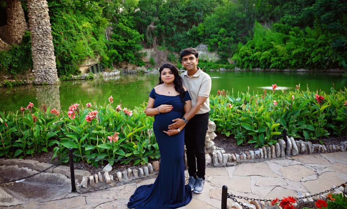 maternity photoshoot in san antonio. Photographer poses expecting mom in gown