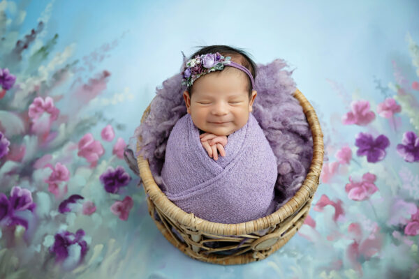 newborn photographer in san antonio photographs baby smiling for newborn photoshoot