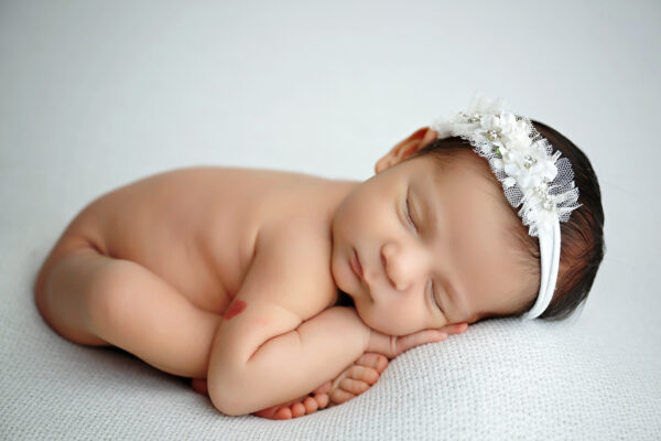 San Antonio newborn photographer captures sleeping newborn baby in white