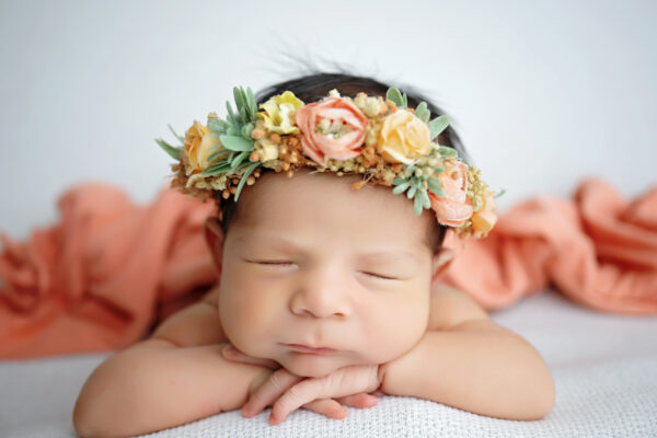 San Antonio newborn photographer captures sleeping newborn baby in white and cute headband