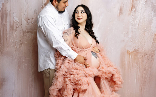San Antonio maternity photographer studio session with couple in blush pink gown
