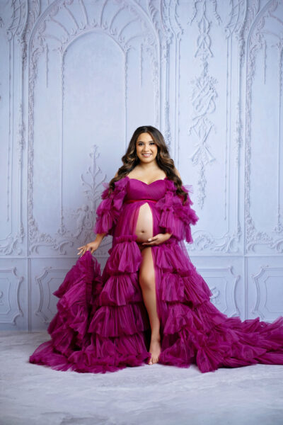 Magenta full-length portrait:
San Antonio maternity photography with dramatic magenta ruffled maternity gown and elegant studio backdrop