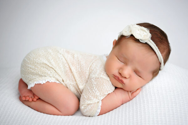 Simple ivory newborn portrait with floral headband