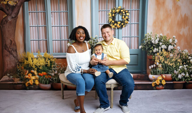 Mom, dad and baby girl posed together for relaxed heirloom family portraits in a San Antonio studio