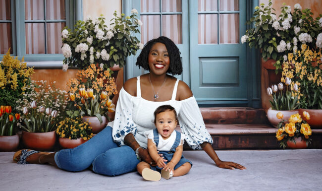 Mother and baby girl smiling together during a studio family photography session in San Antonio